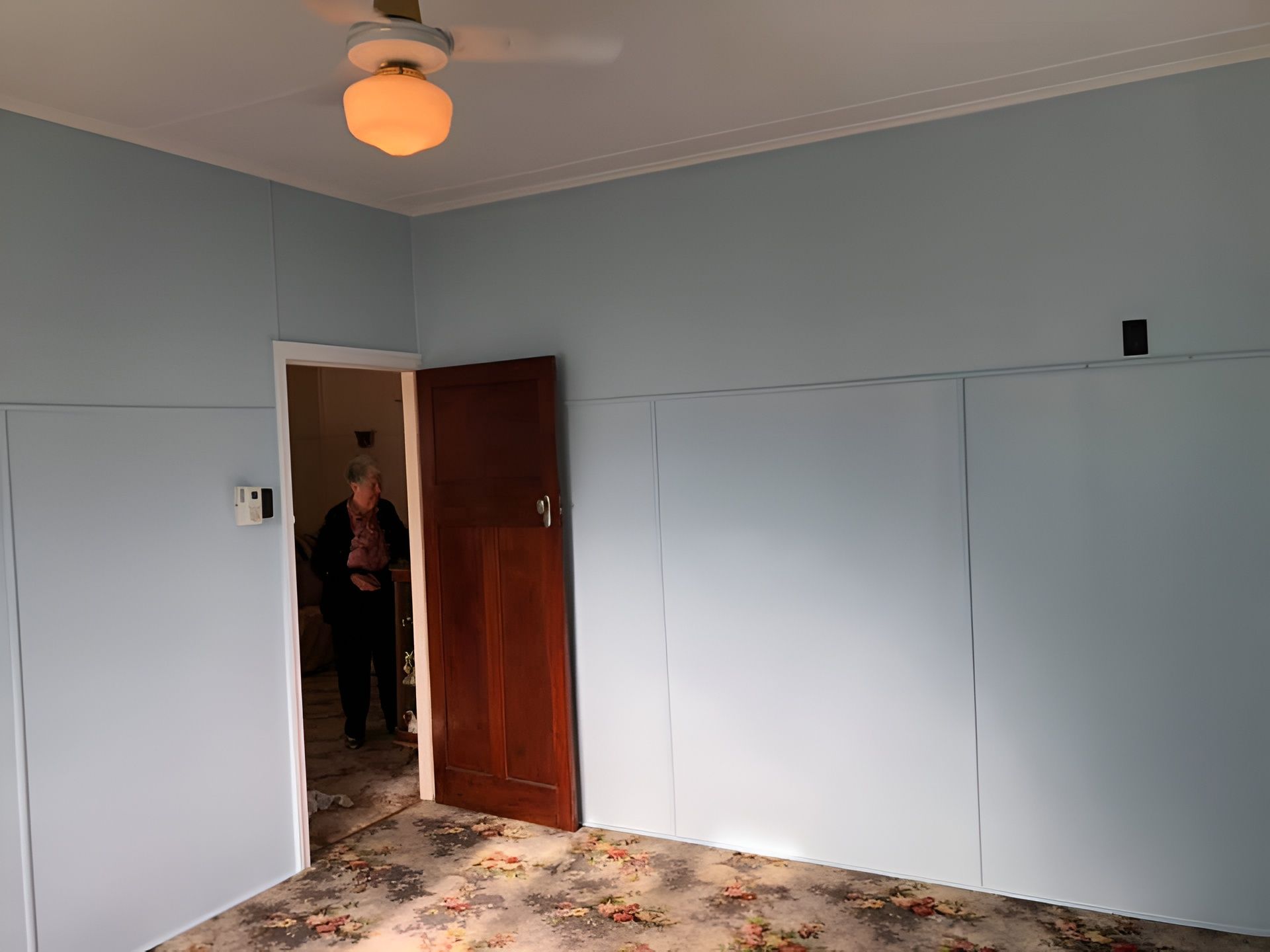 Empty Room With Blue Walls, Dark Brown Door — Allman's Painting in Maroochydore, QLD