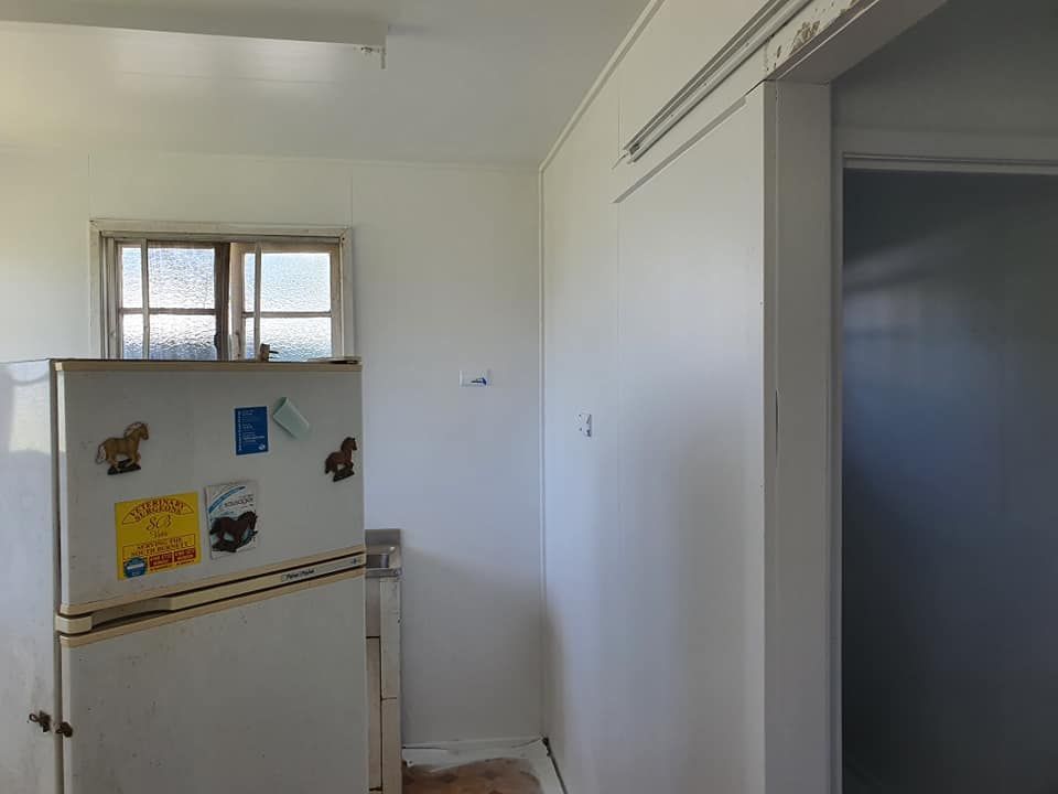White Kitchen With Refrigerator, Window, And Doorway — Allman's Painting in Nambour, QLD