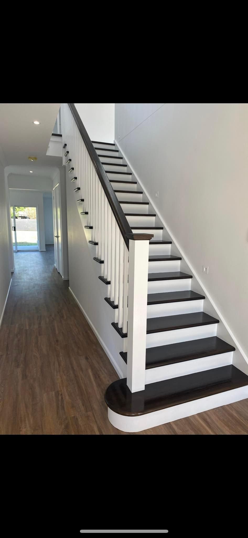 A Black and White Staircase in A Hallway in A House — Allman's Painting in Monkland, QLD