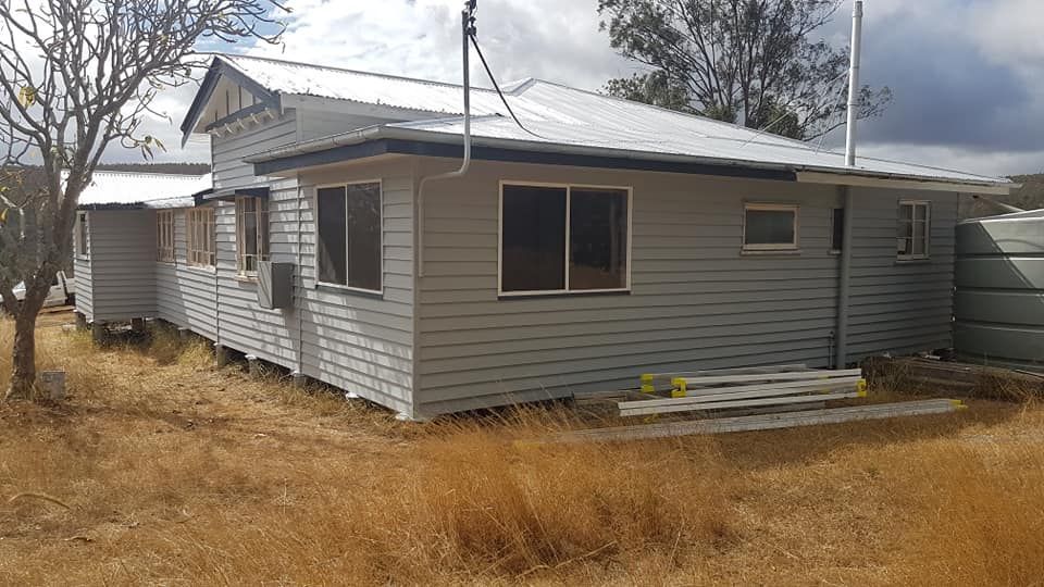 Gray House With White Roof — Allman's Painting in Cooroy, QLD