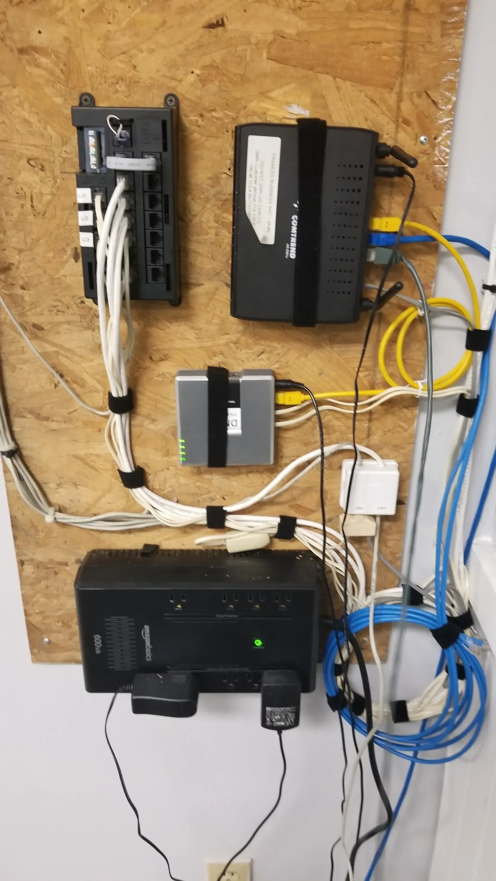 A wall with a lot of wires connected to it.