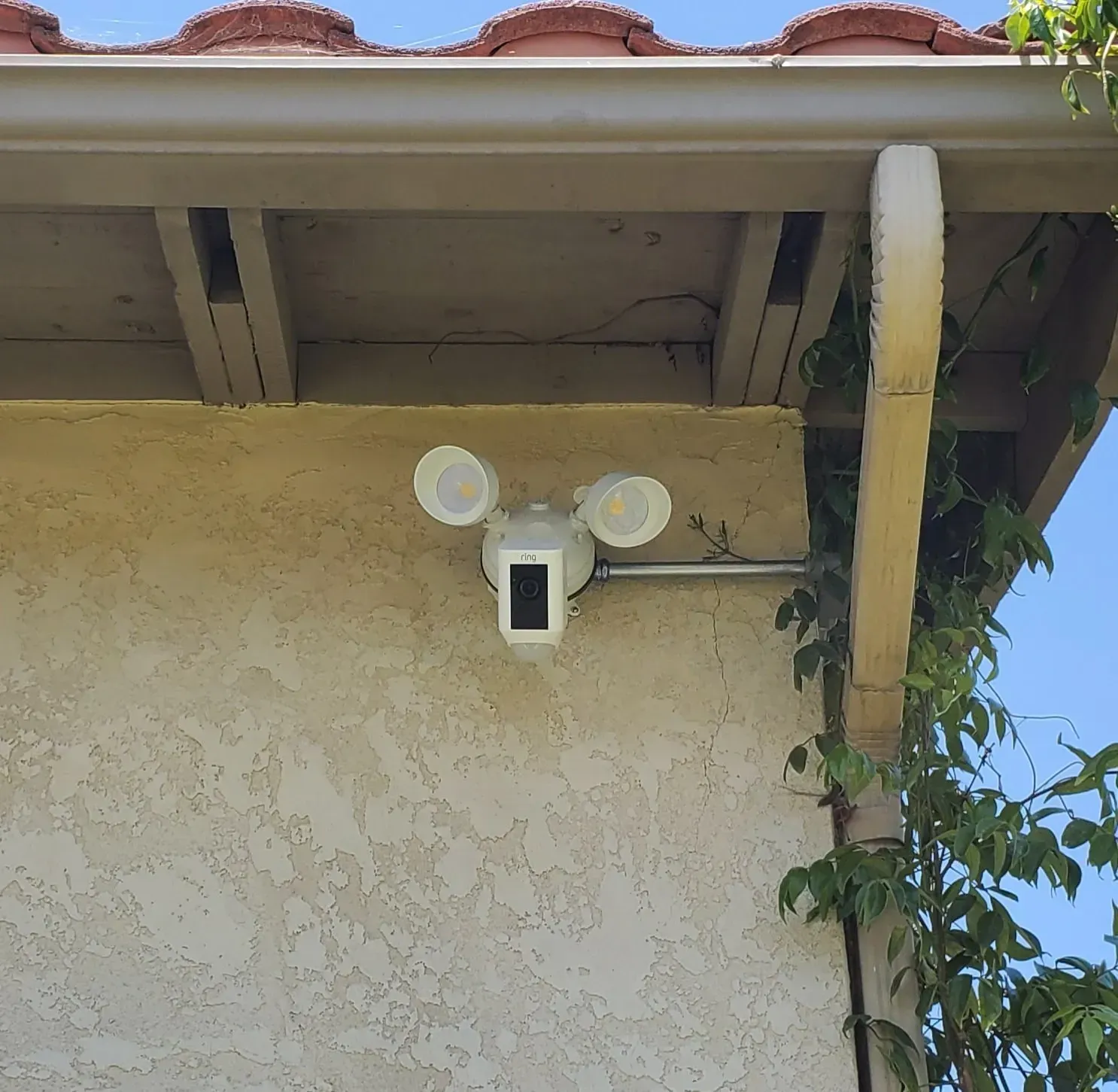 A security camera mounted to the side of a building