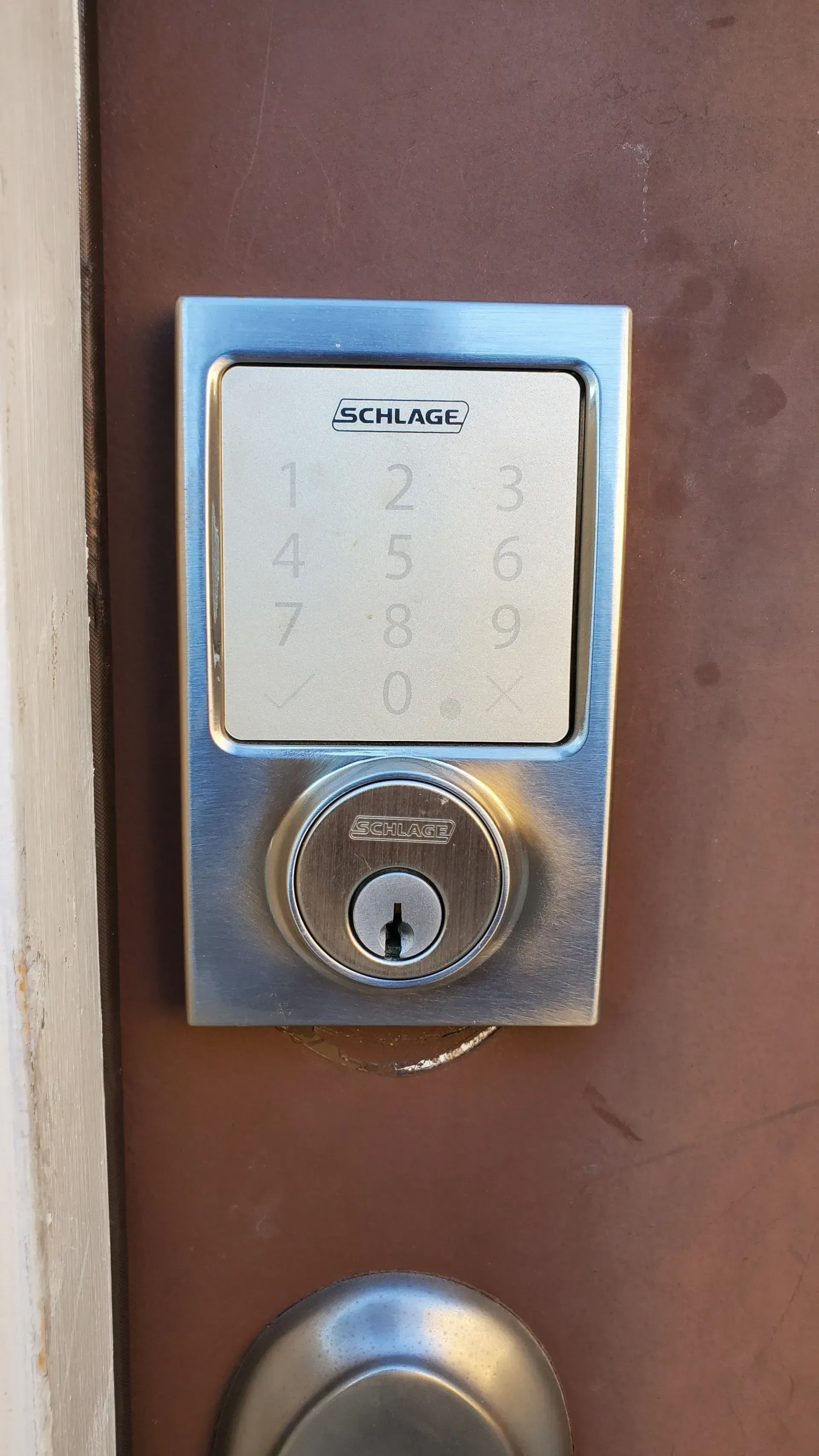 A close up of a keypad on a door.