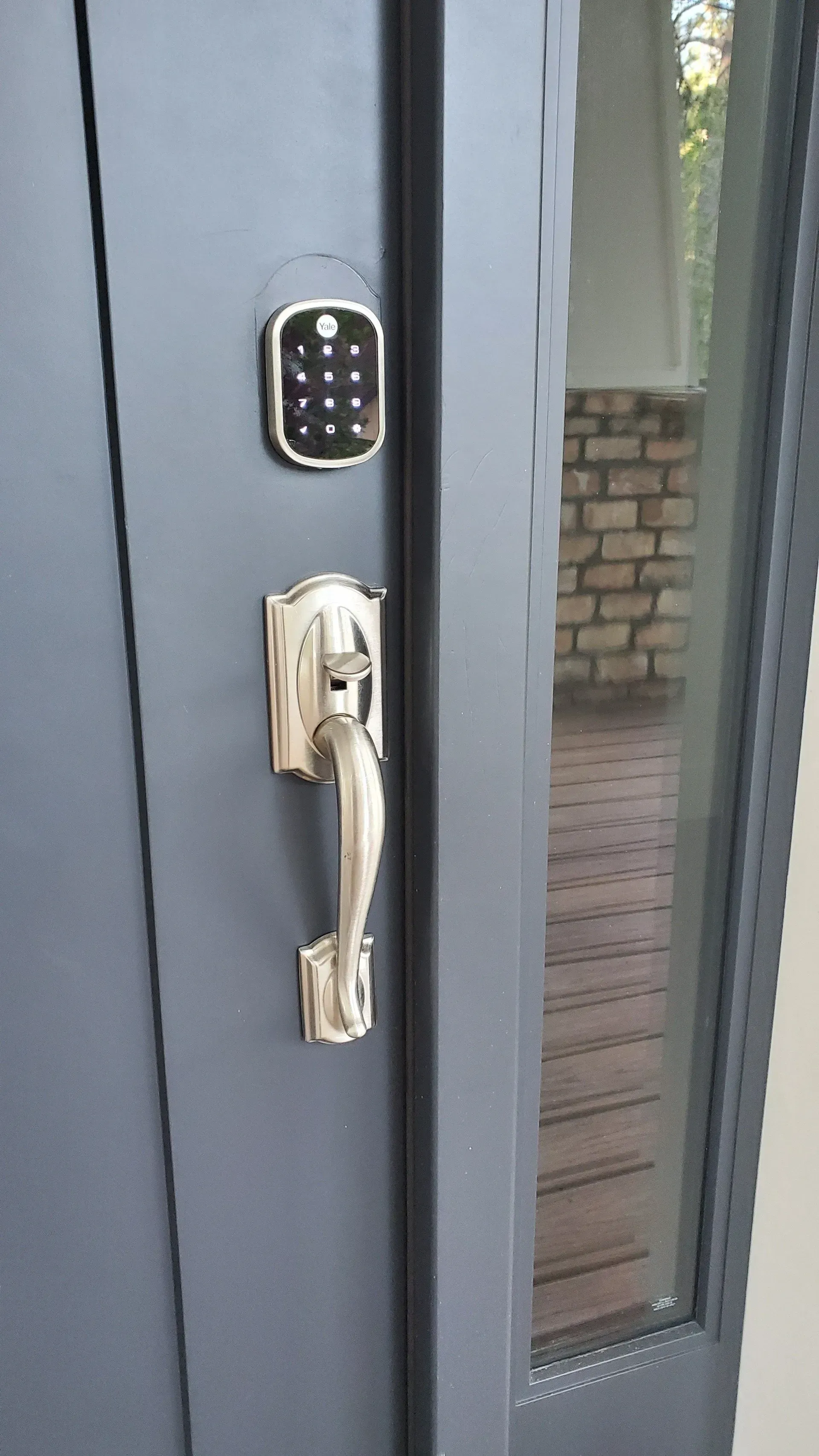 A close up of a door with a digital lock on it.