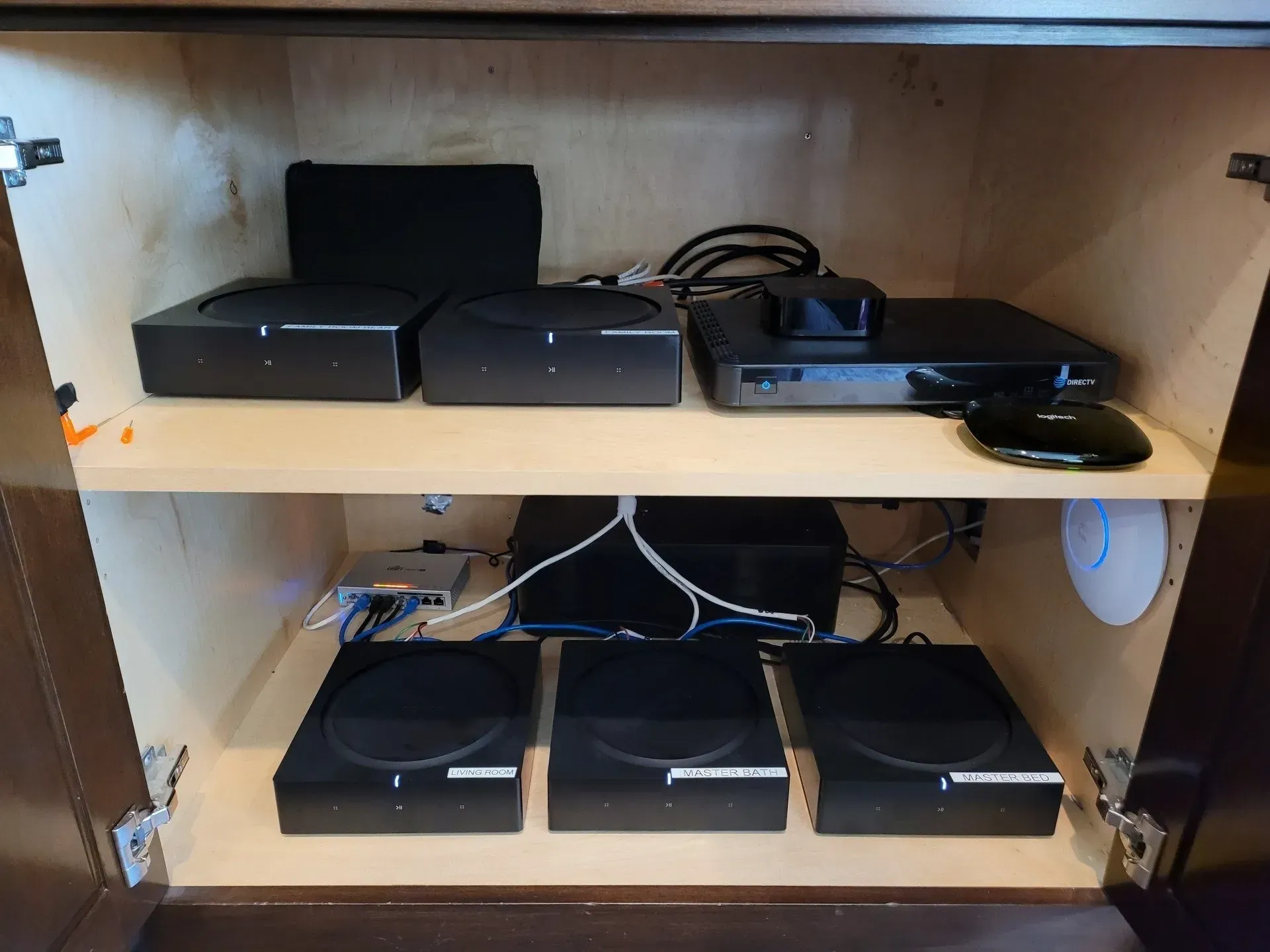 A shelf with a bunch of electronic devices on it