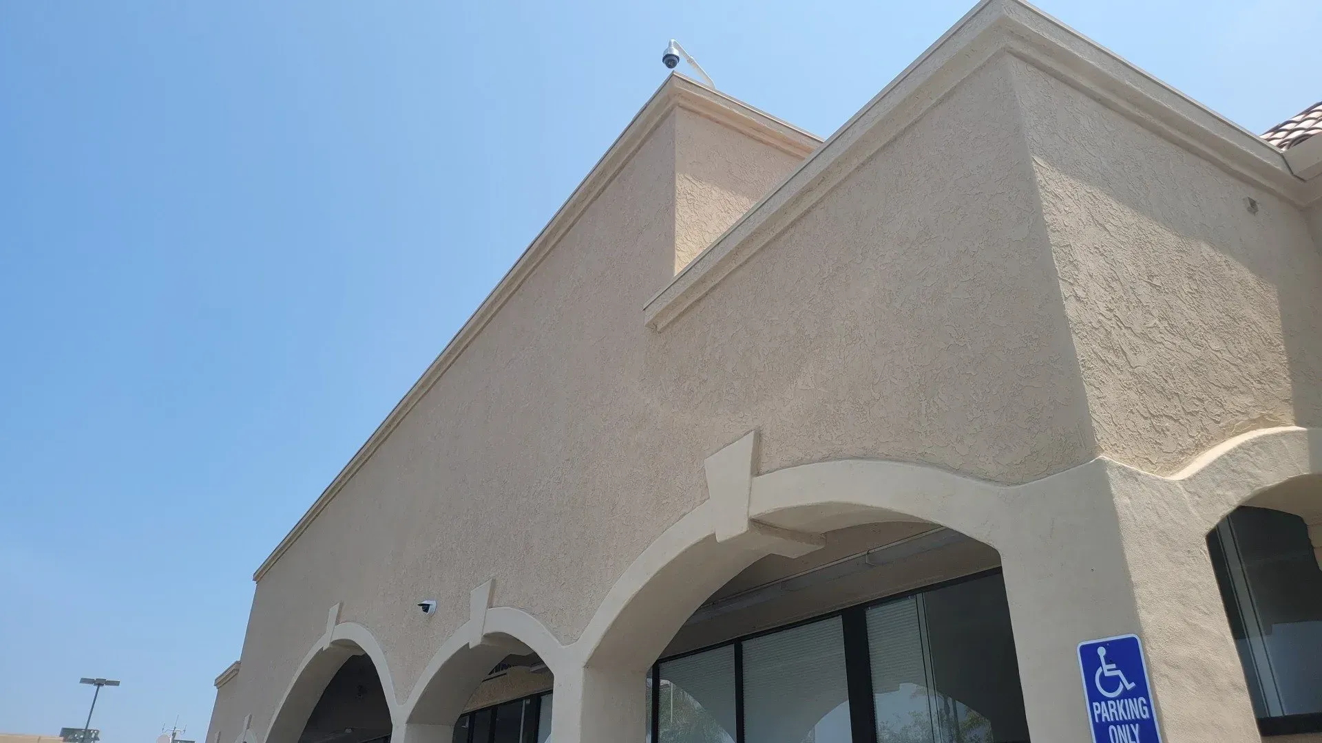 A building with a handicapped parking sign on it