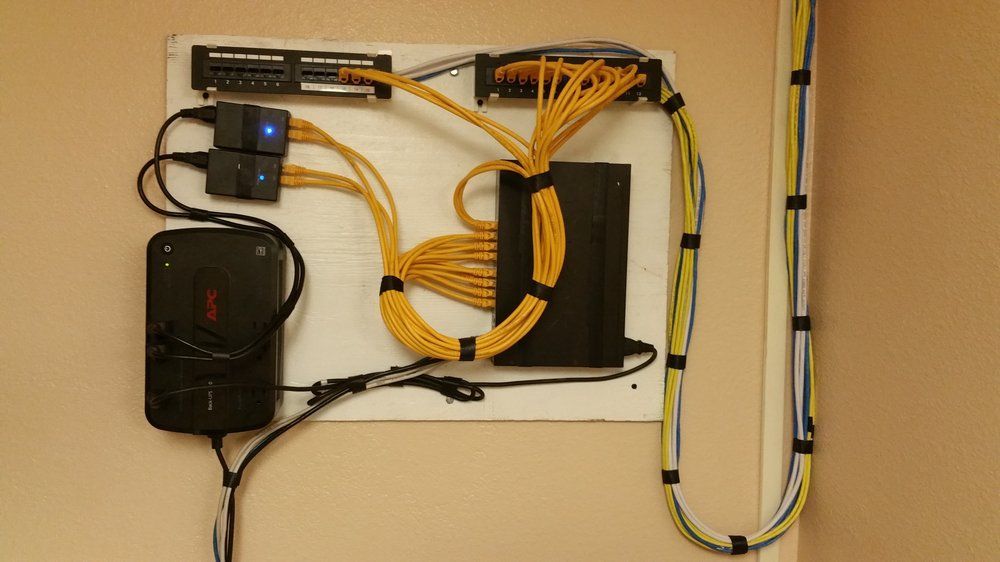 A wall with a bunch of wires connected to it