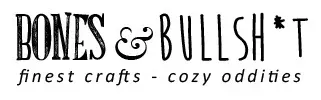 Black-and-white logo reading “BONES & BULLSH*T” with tagline “finest crafts - cozy oddities”