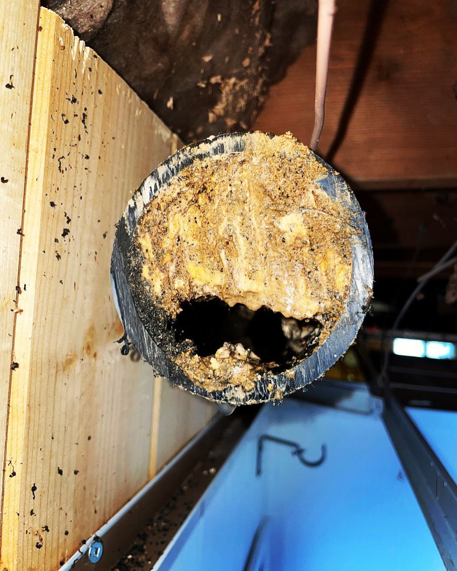 A pipe with a hole in it and the number 2 on it