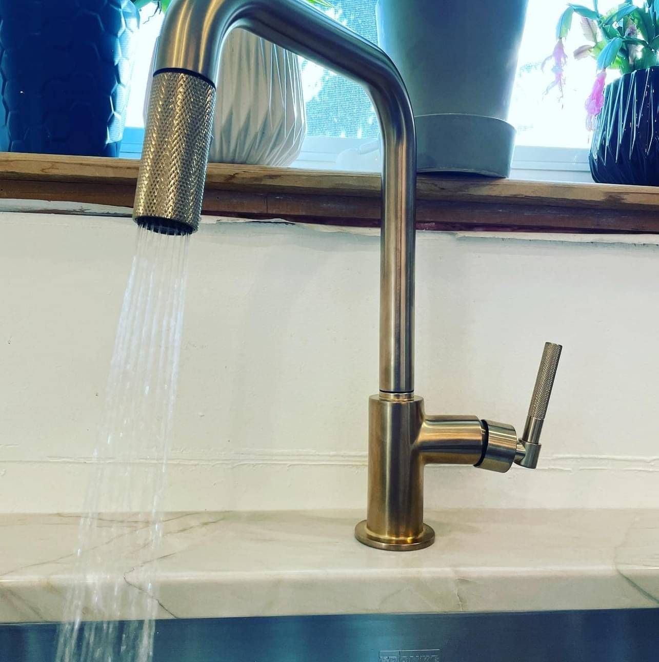 A close up of a faucet with water running out of it