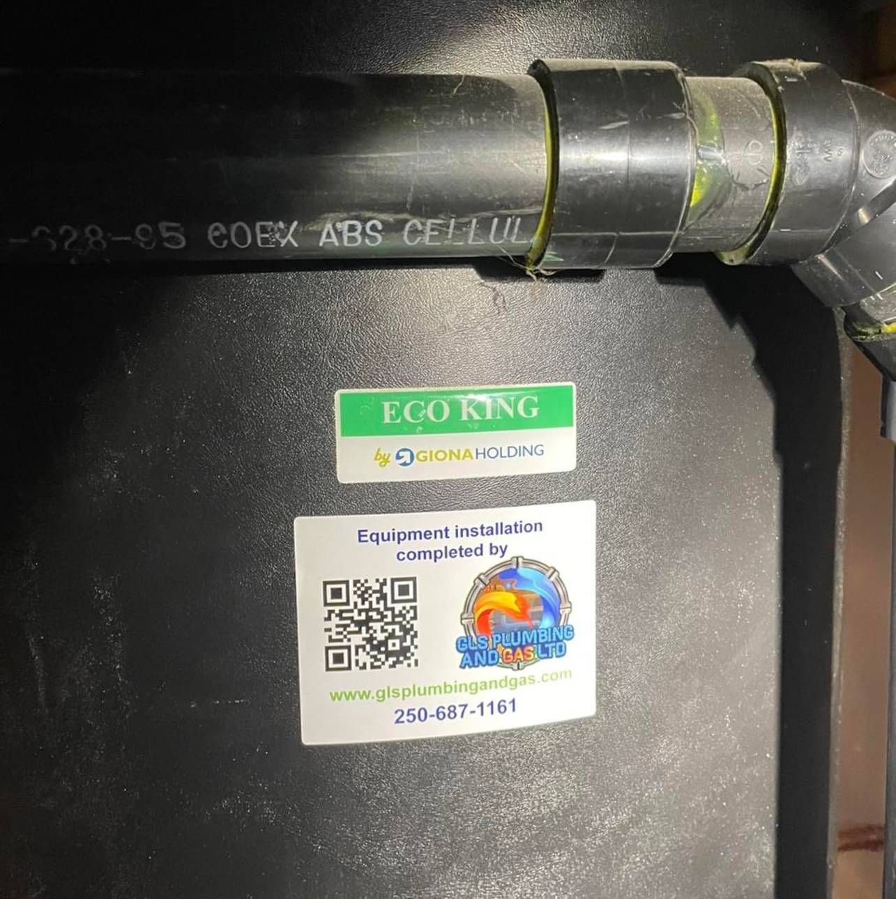 A black pipe with a sticker on it that says eco king