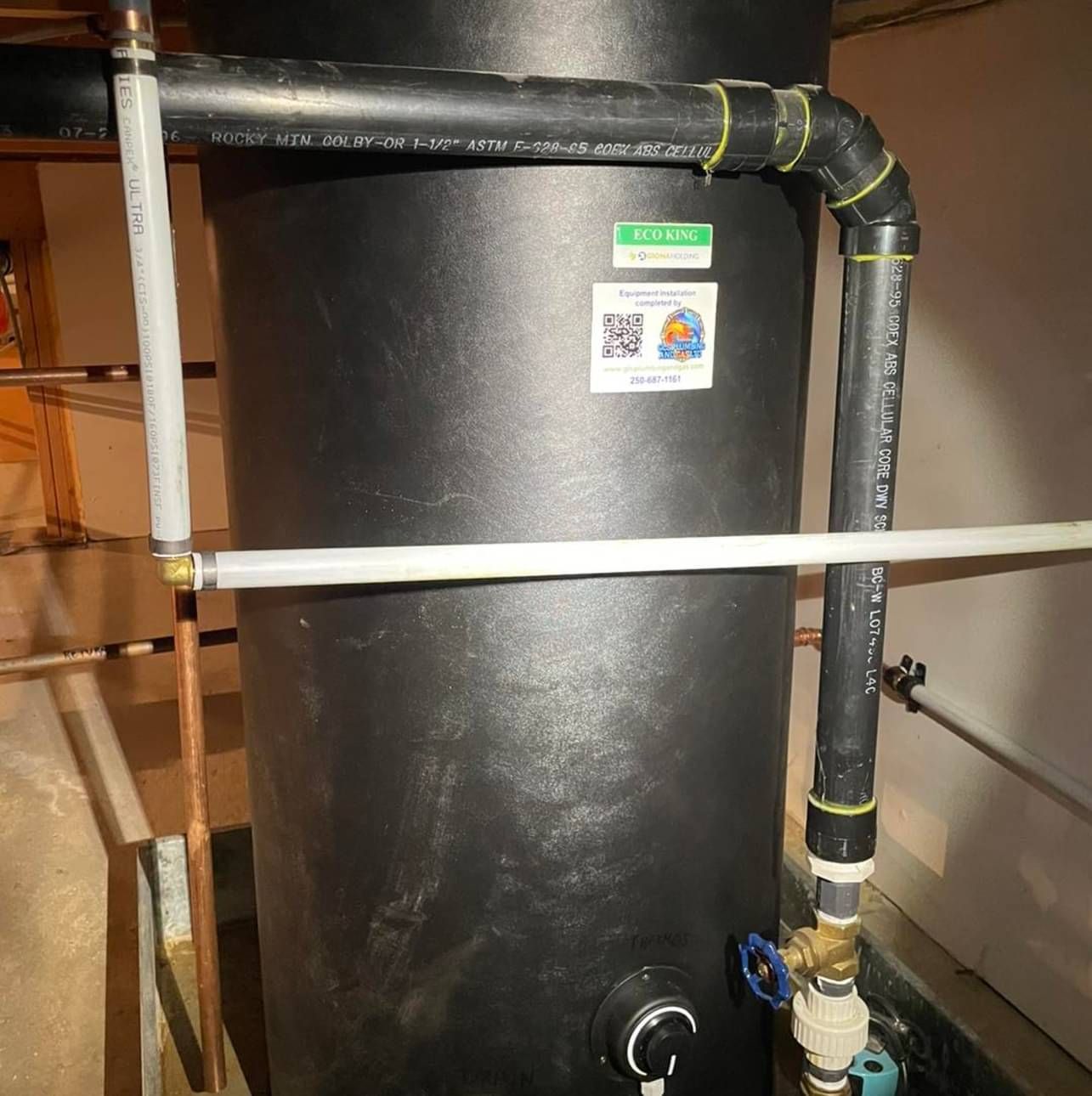 A black cylinder with a sticker on it that says ' 50 '