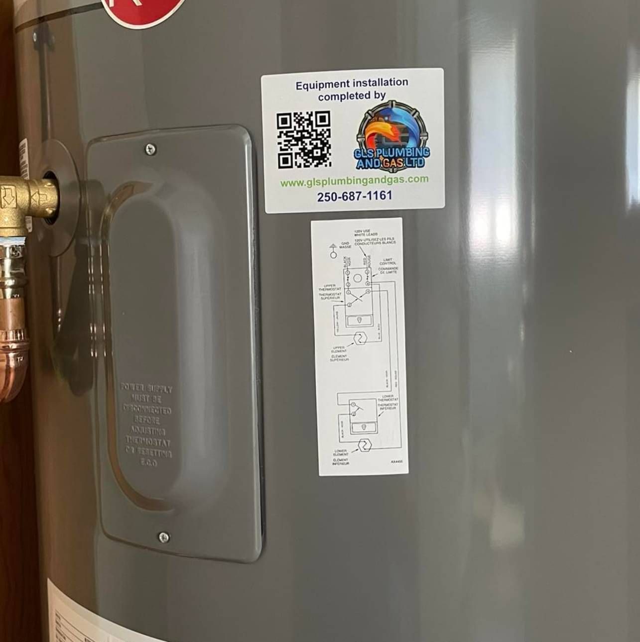 A close up of a water heater with a sticker on it.