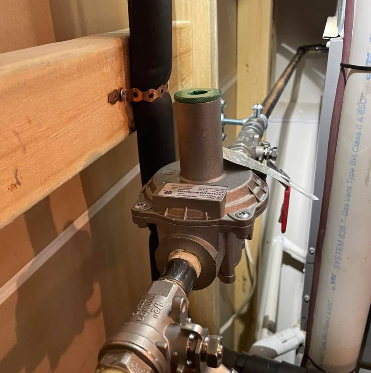 A close up of a pipe with a valve on it