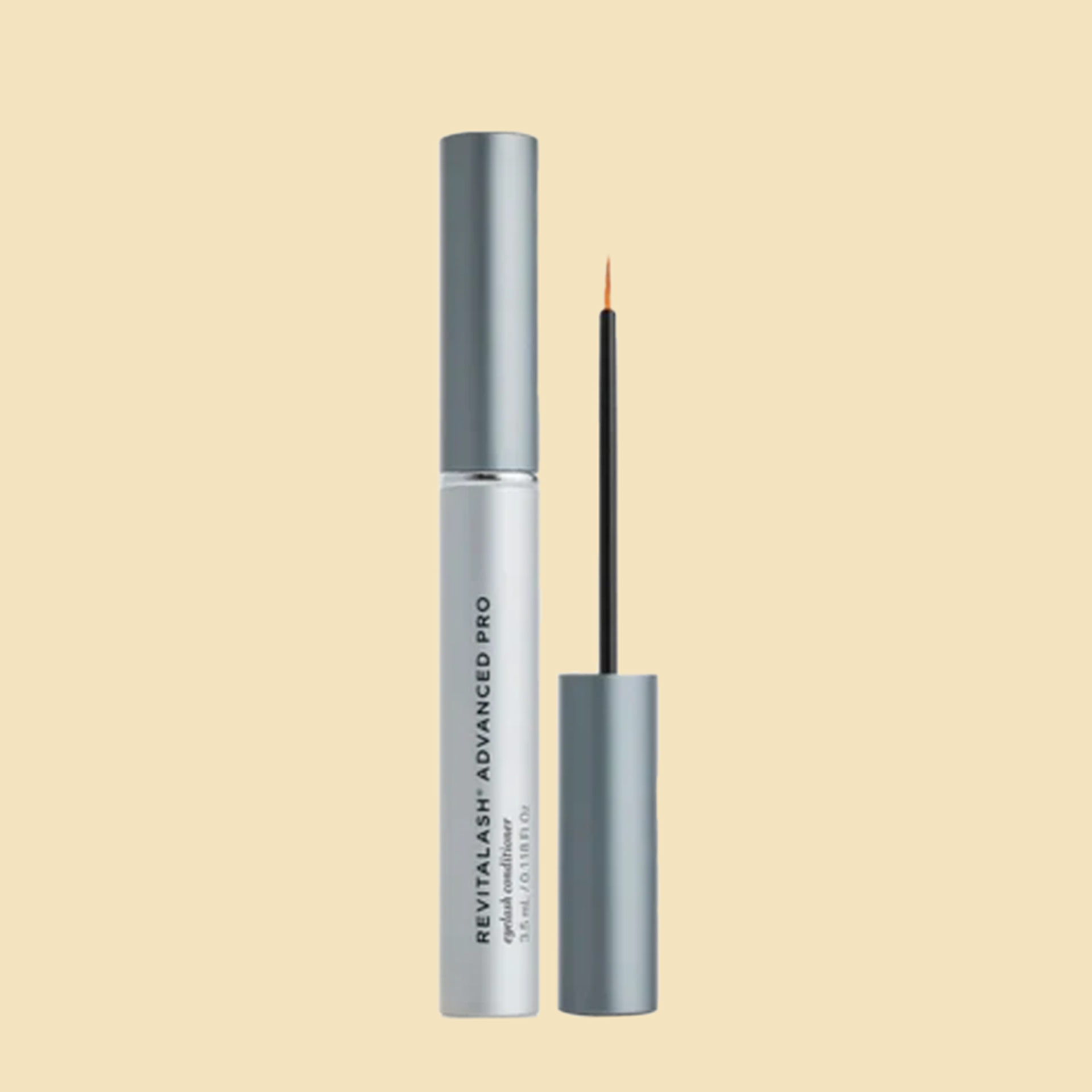 A bottle of revitalash advanced pro eyelash serum with a brush.