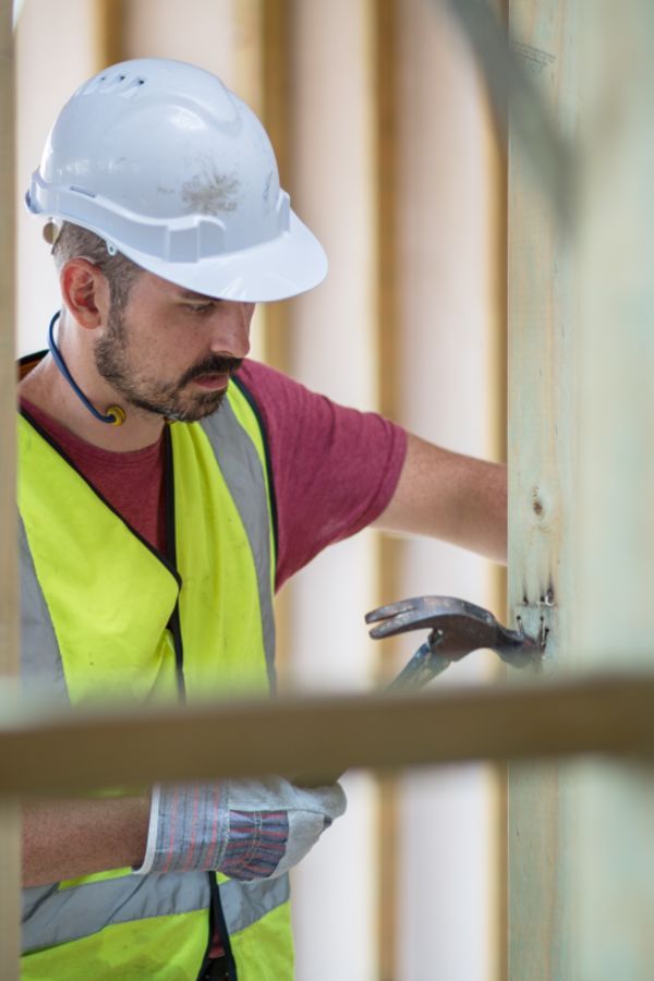 Builder working on a house frame