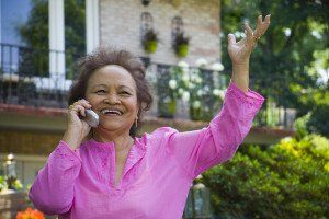 older woman smiling on the phone