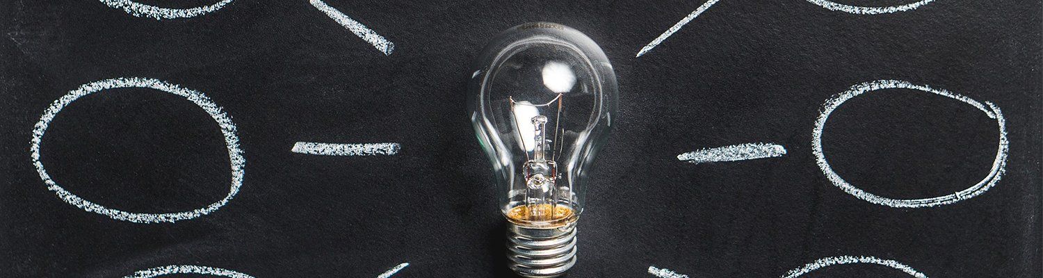 lightbulb surrounded by chalk emphasis symbols