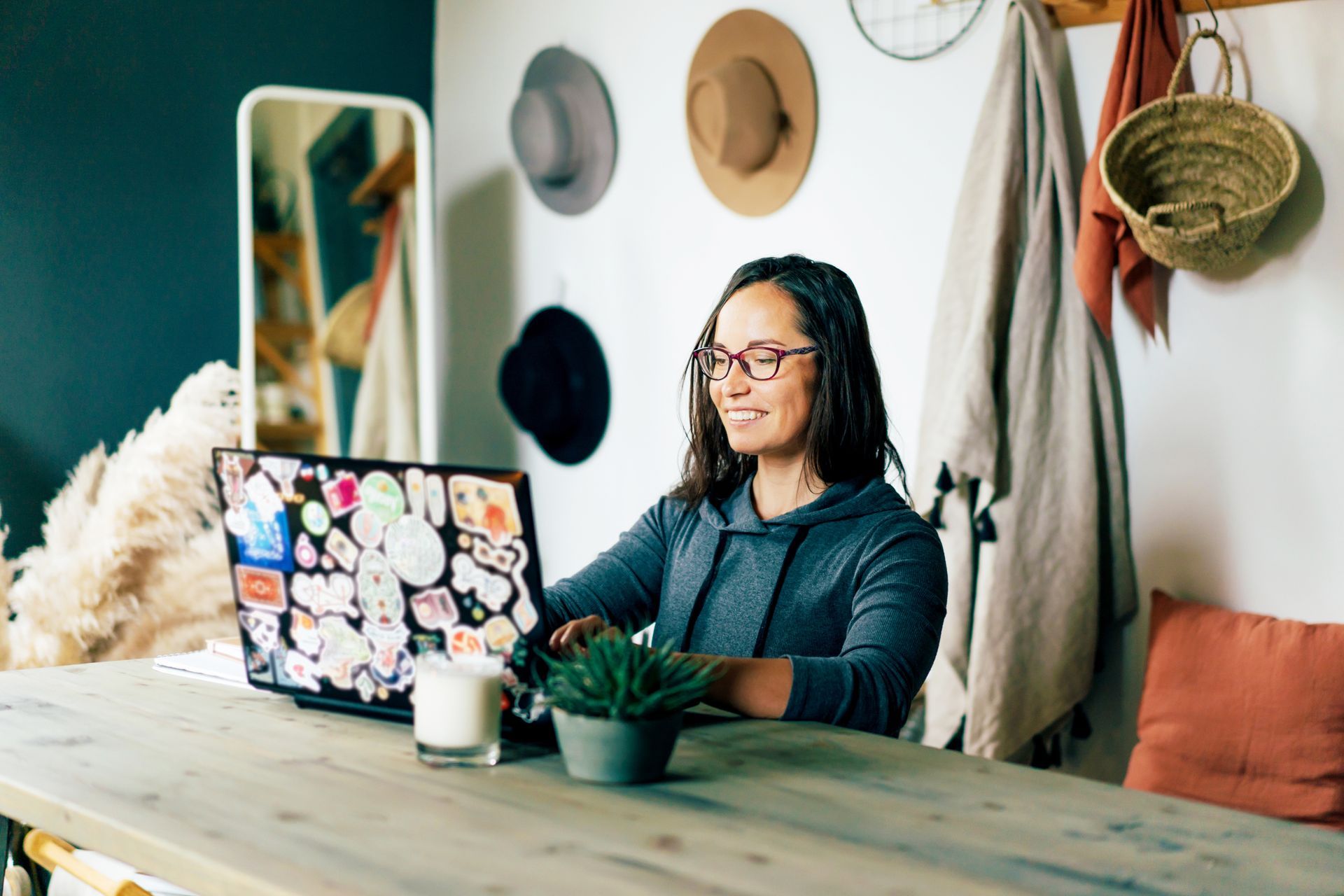 woman smiling at laptop