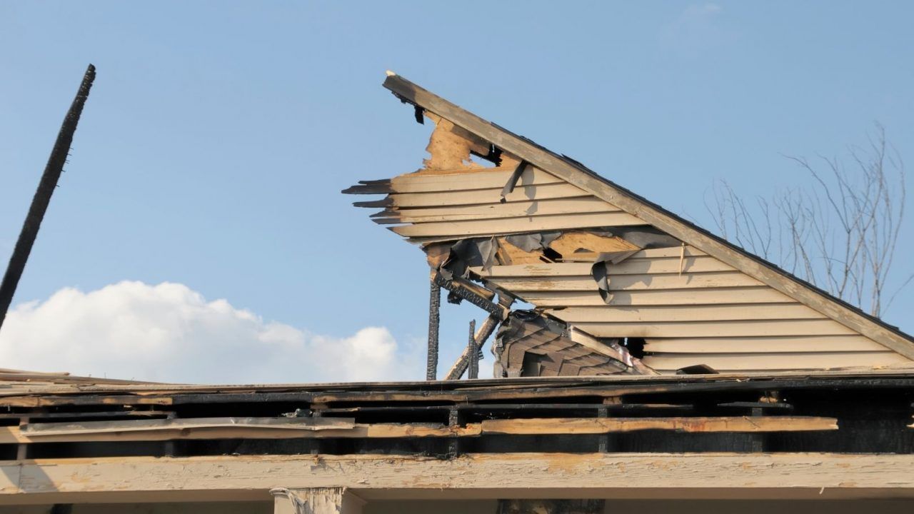 A roof of a house that has been damaged by a storm.