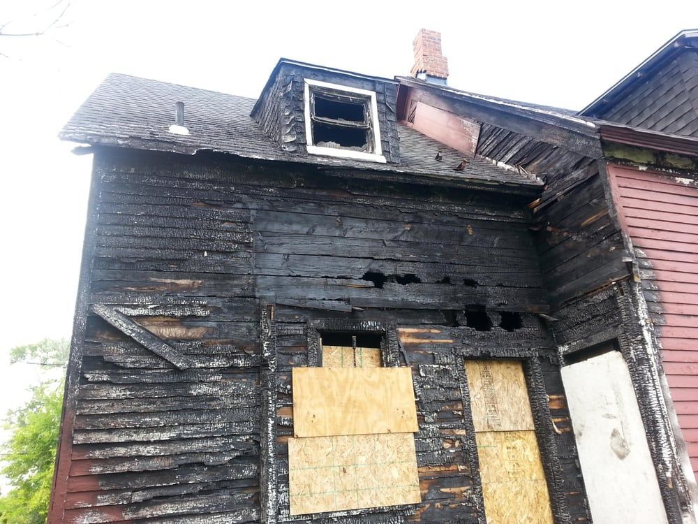 An old wooden house with a broken window