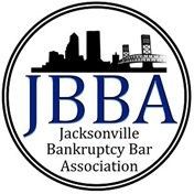 Logo of the Jacksonville Bankruptcy Bar Association: blue letters over city silhouette within a double-lined circle.