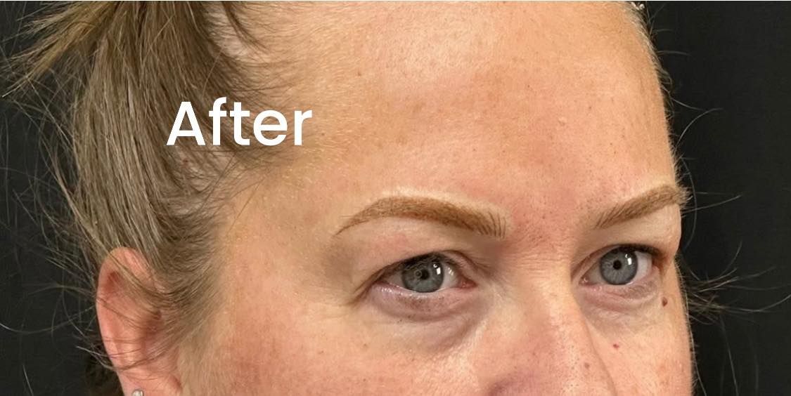 Close-up of a person's face showing eyebrows, eyes, and forehead. The word 