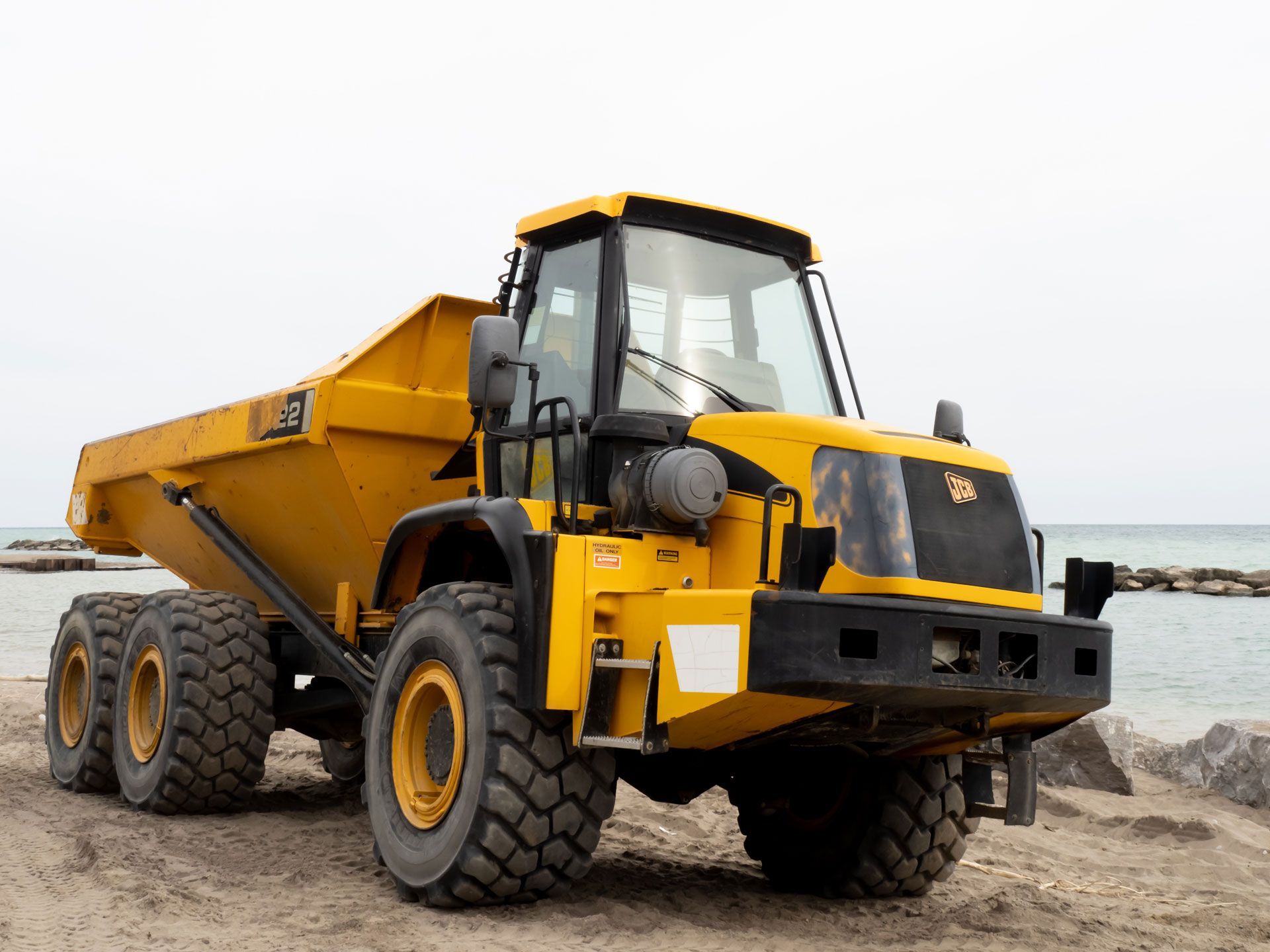 A small yellow dump truck