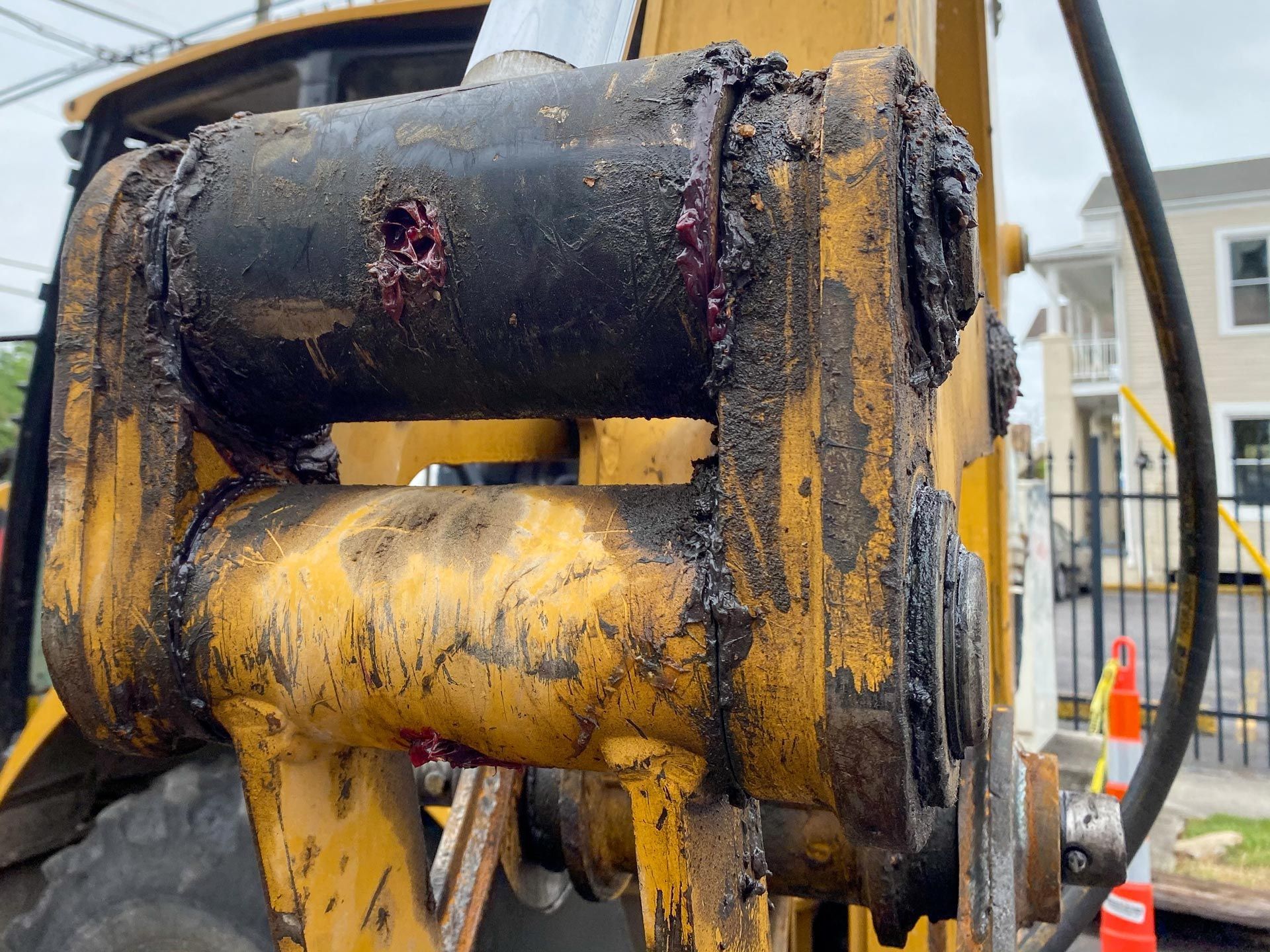 A close up of a piece of machinery with grease oil