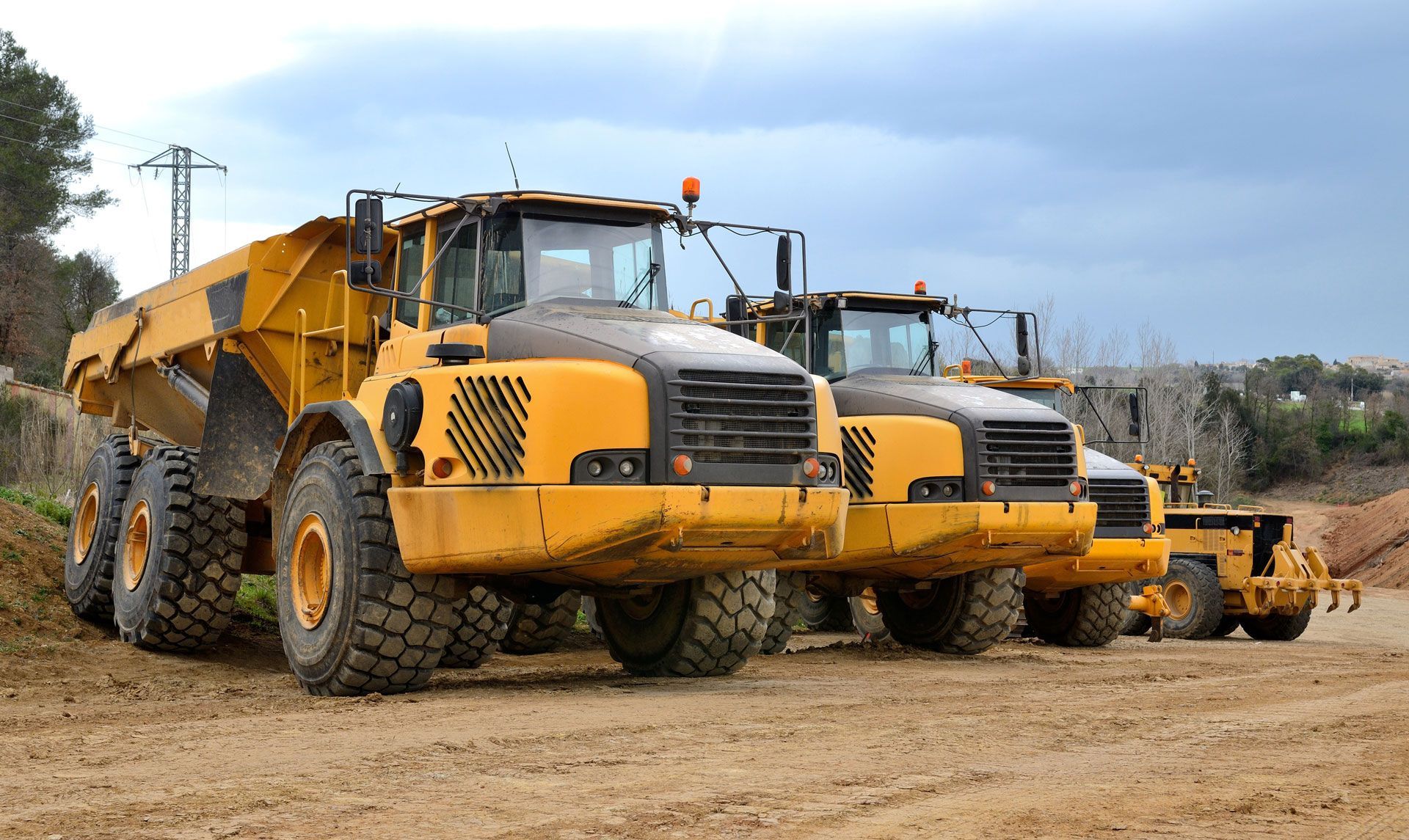 A small yellow dump truck