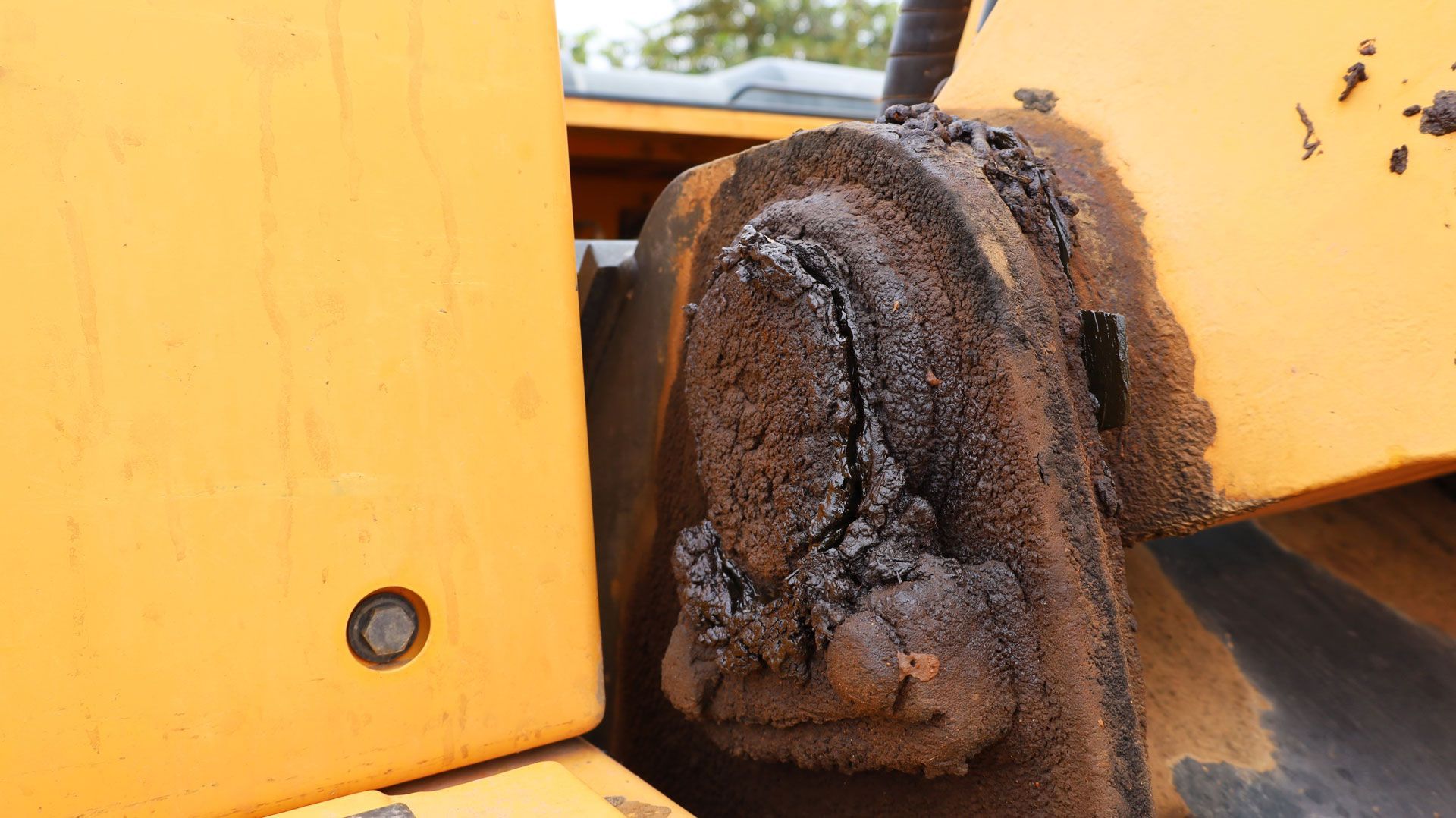 A small yellow dump truck