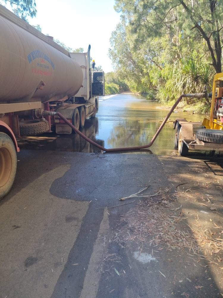 Tanker Truck is Pumping Water Into a River — Burnett Contracting in Cloncurry, QLD