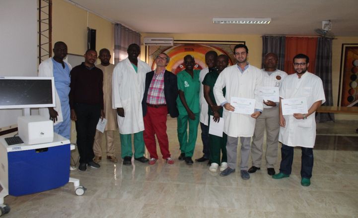 A group of doctors and nurses posing for a picture