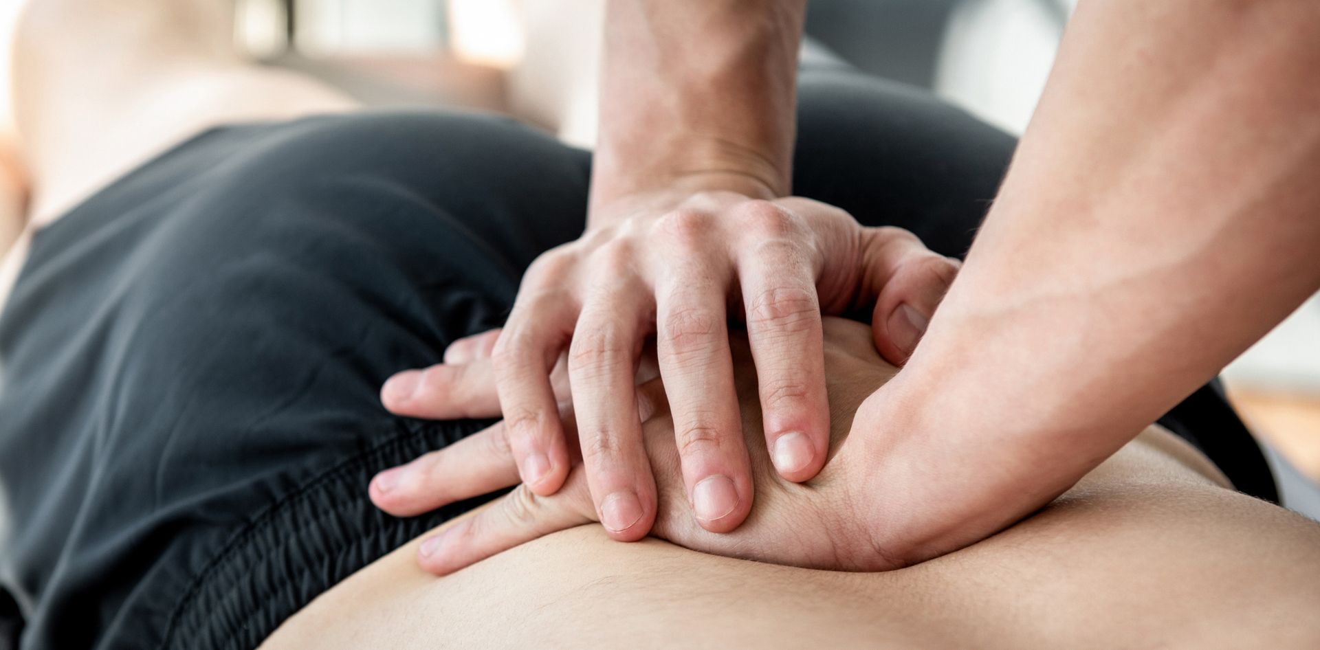 a man is giving a woman a massage on her back