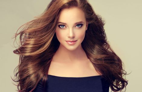Brunette Woman with Long Blow-Dried Hair — Trendy Hairdresser in Cairns, QLD