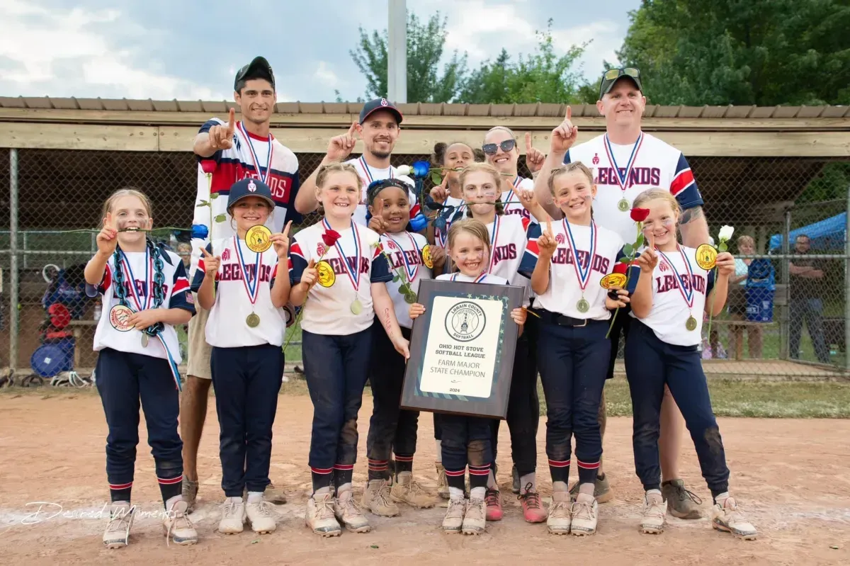Legends Athletics softball team holding a trophy