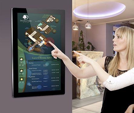 blonde girl looking at a digital map