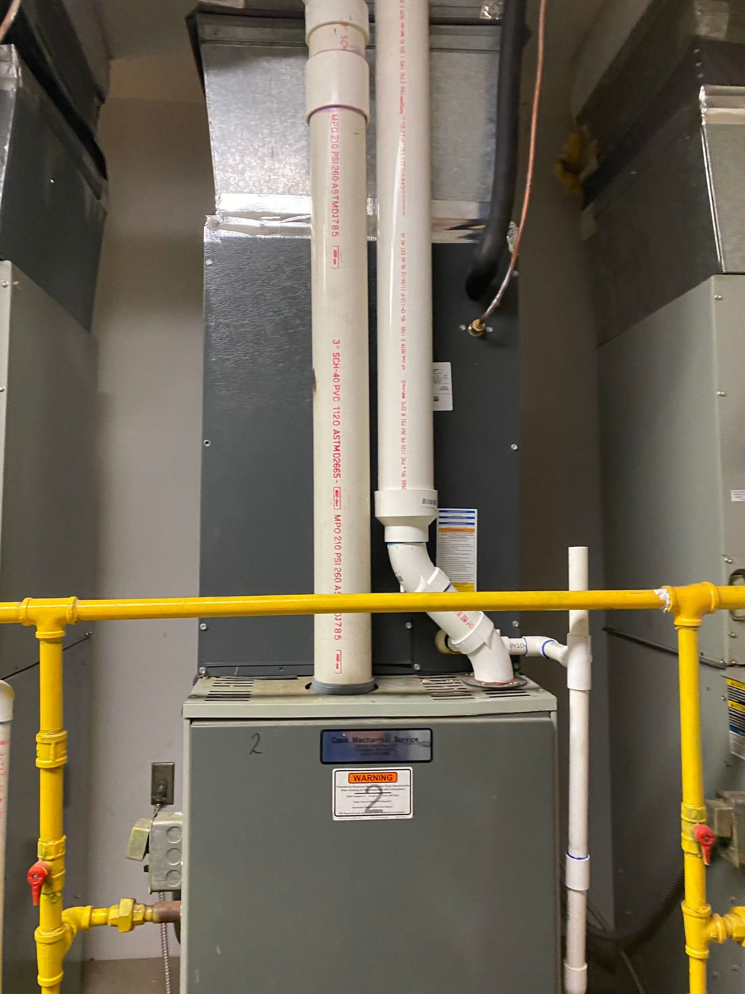 An air conditioner with a warning sign on it