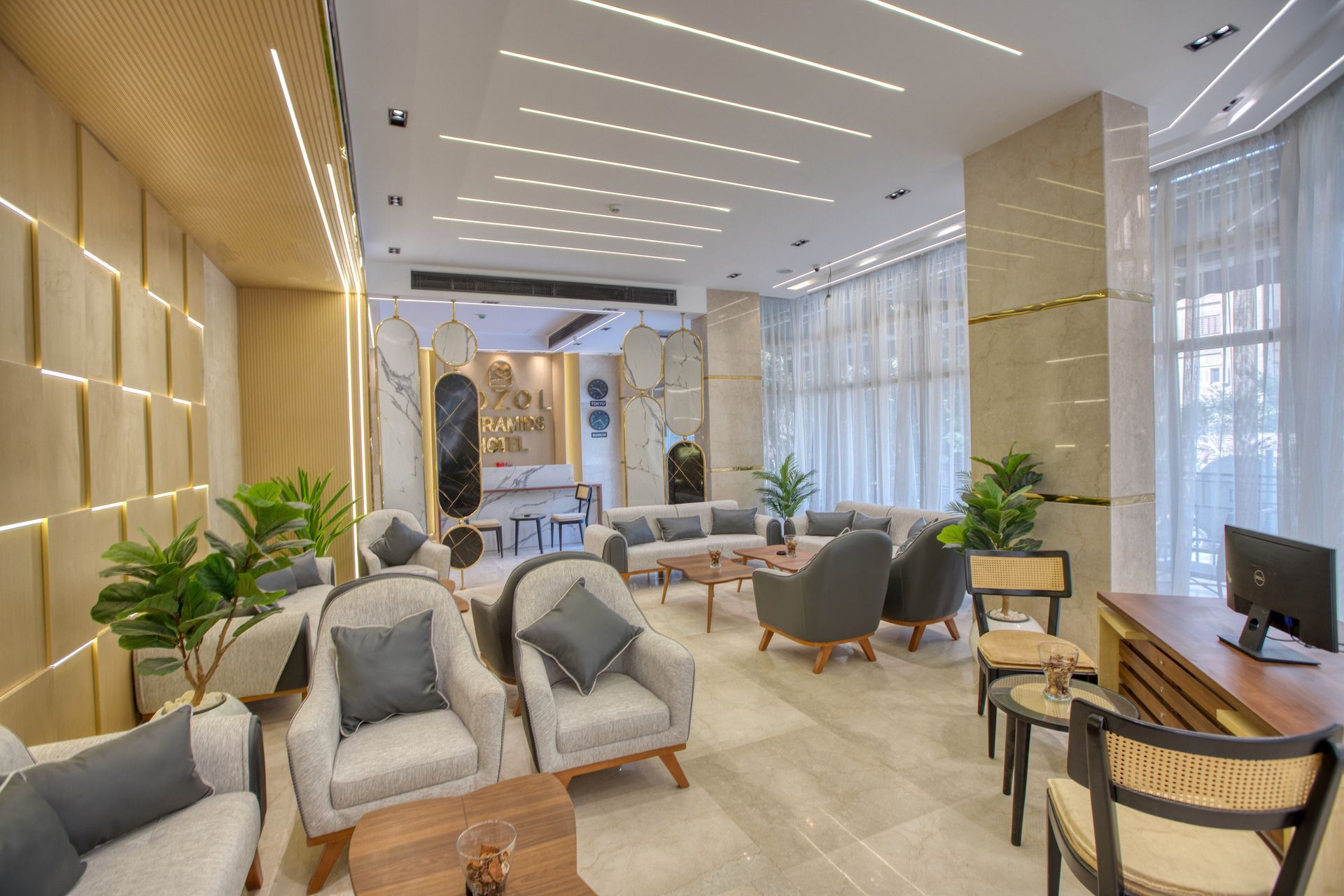 A living room filled with furniture and a computer.
