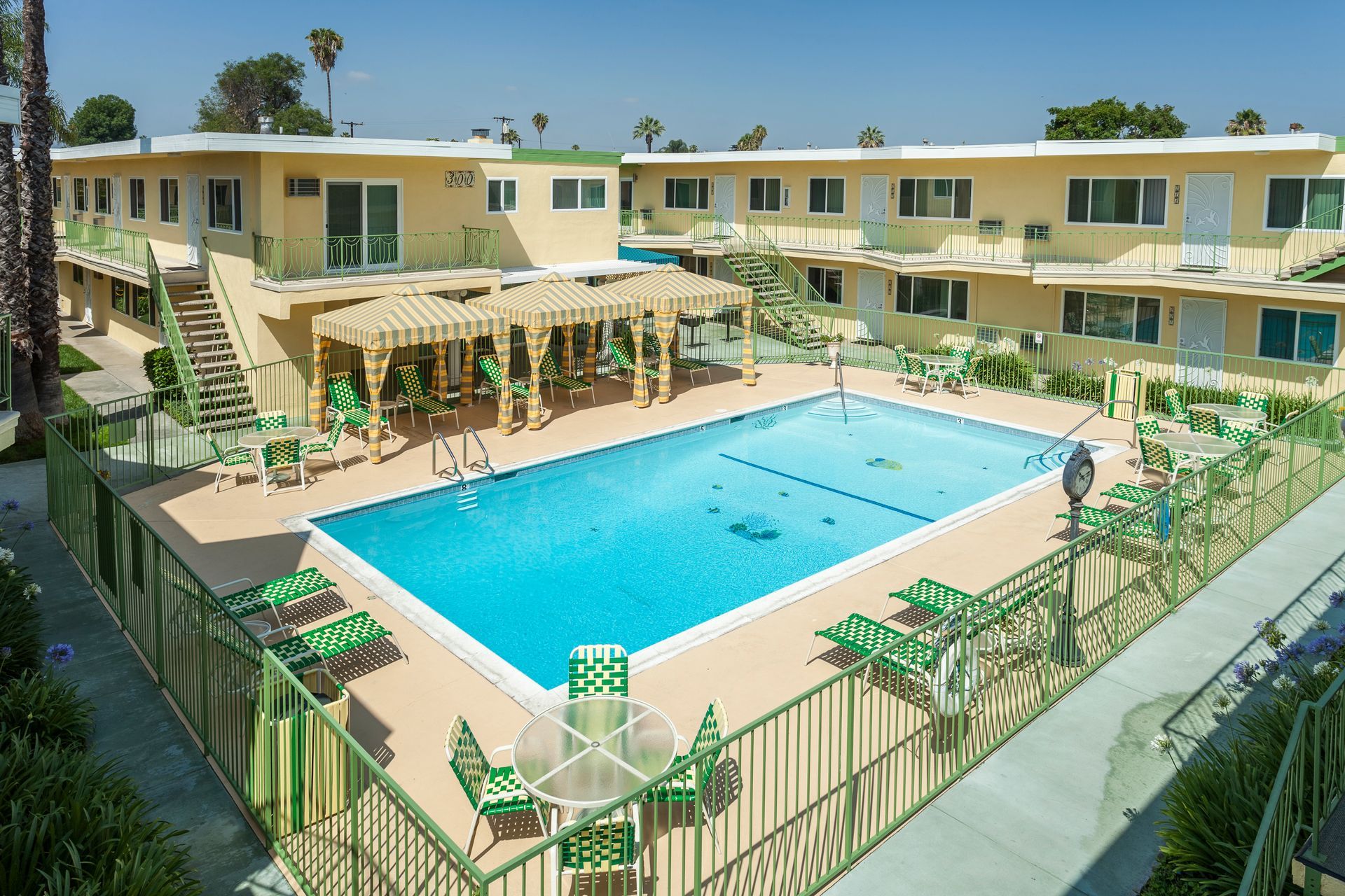 A large swimming pool in front of a building