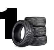 Stack of black tires beside a large number 1 on white background | 106 St Tire and Wheel
