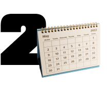 Large black number 2 beside a desktop calendar page for May 2021 | 106 St Tire and Wheel