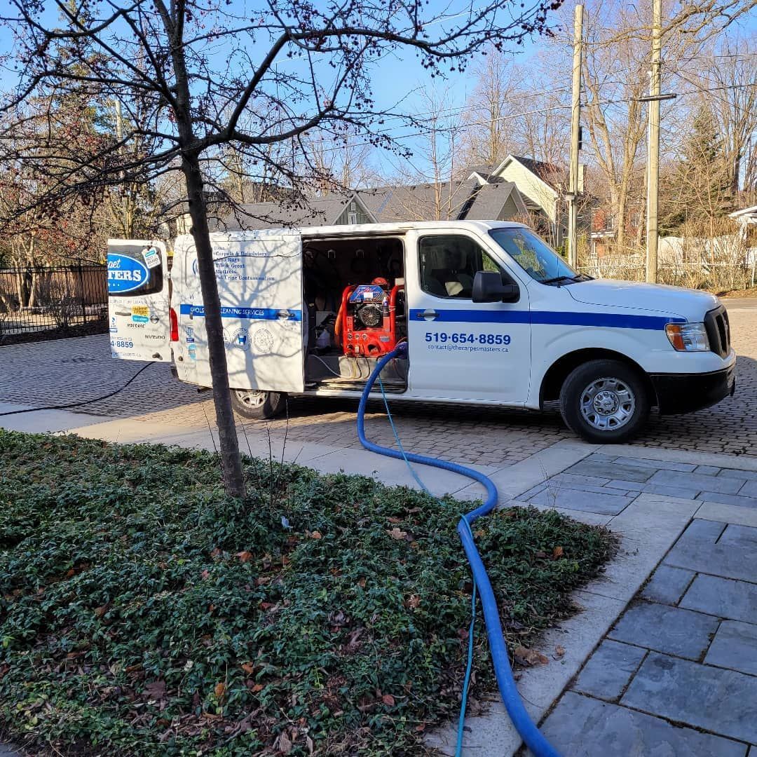 A man in a hard hat is working on an air conditioner.