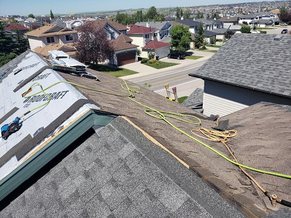 A roof is being repaired in a residential area