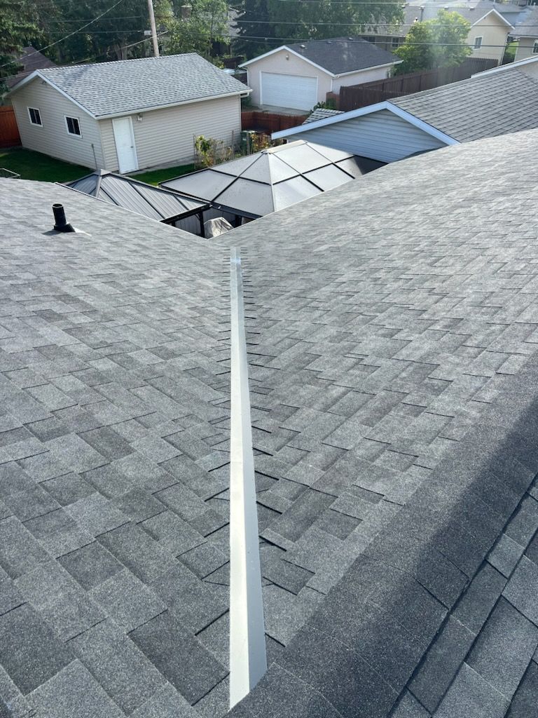 An aerial view of a roof of a house with a white trim.