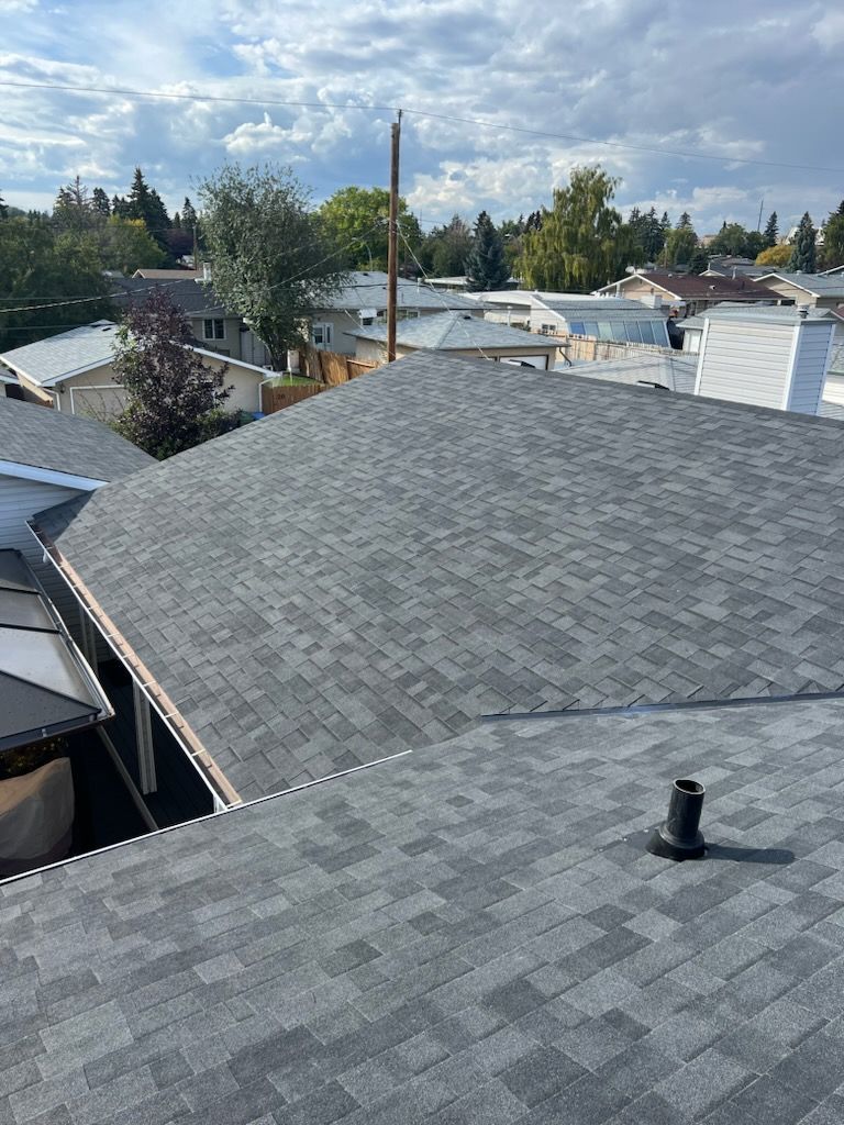 An aerial view of a roof with a chimney on it.
