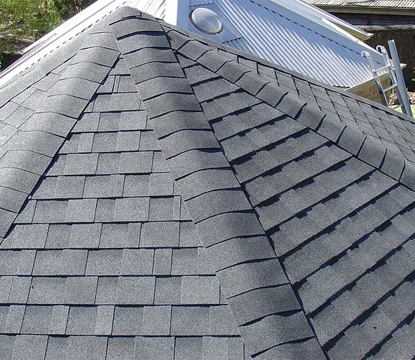 A close up of a roof with shingles on it