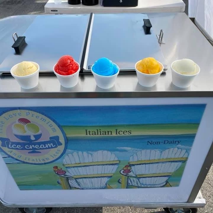 An ice cream cart that says italian ices on it