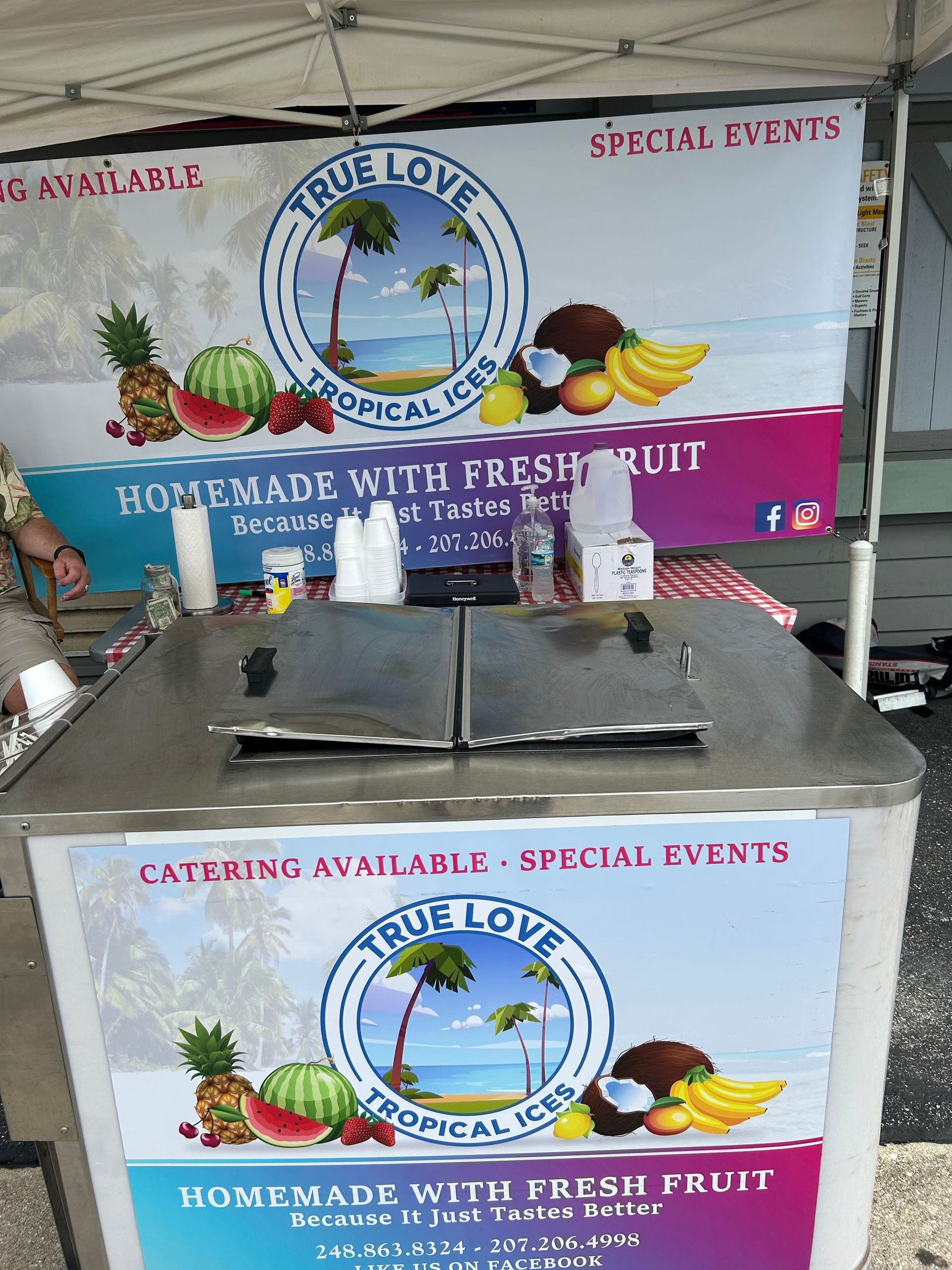 A table with a sign that says homemade with fresh fruit