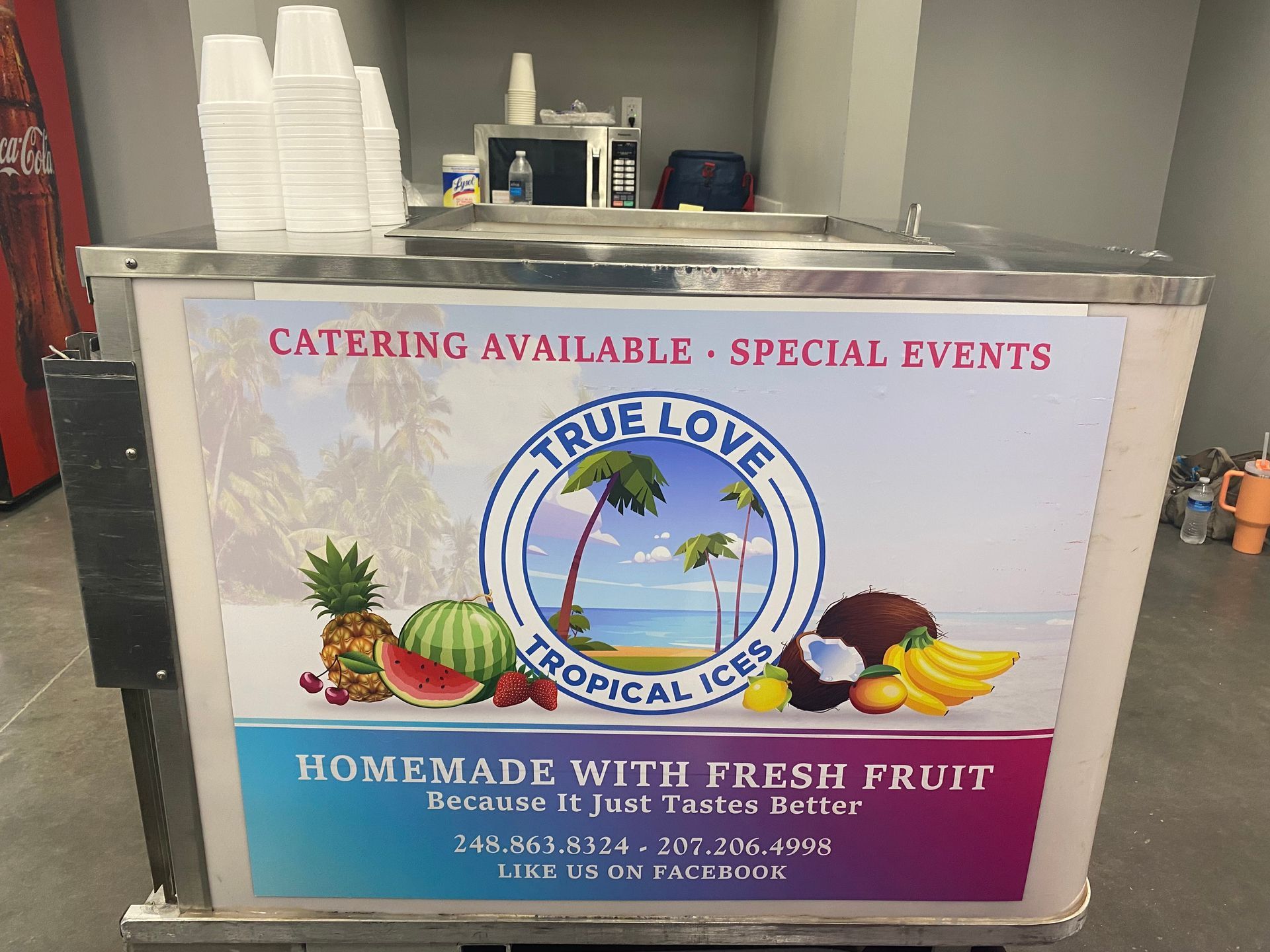 A sign for true love tropical ices says homemade with fresh fruit